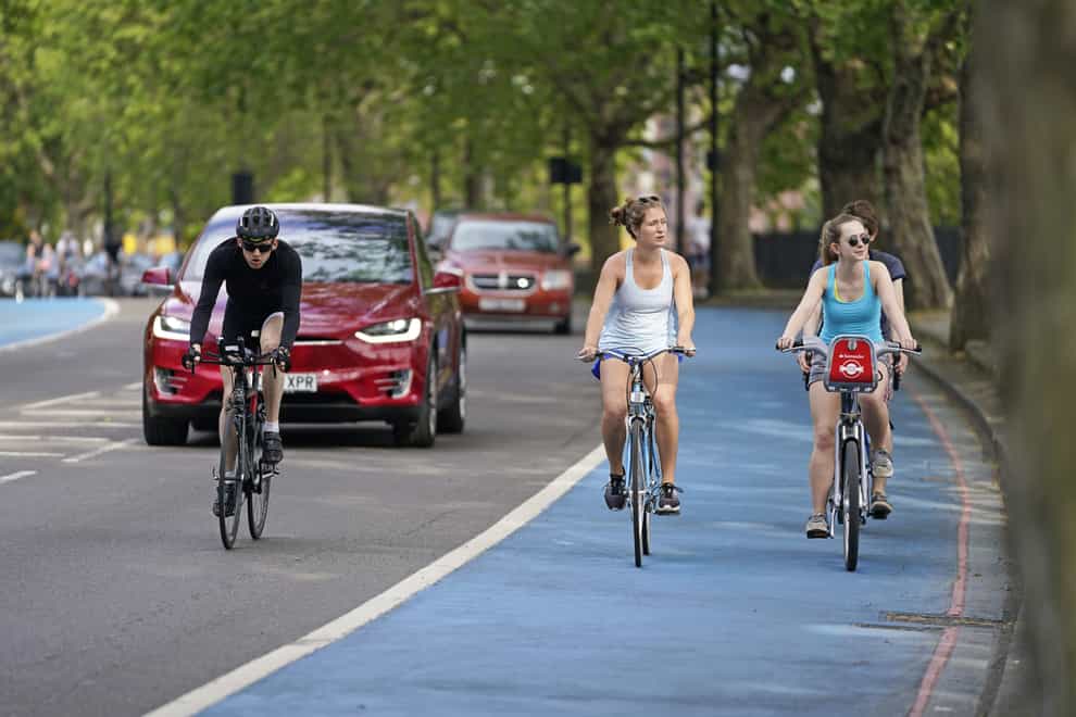 People riding bicycles in a cycle lane in Chelsea