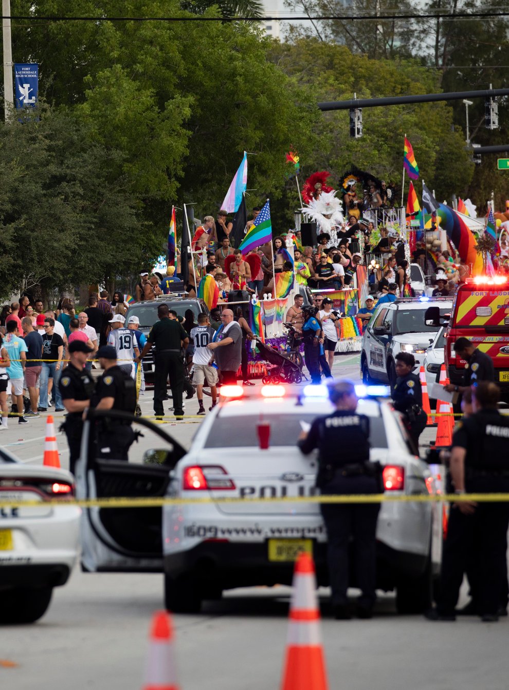 Police and firefighters respond after a truck drove into a crowd of people injuring them during The Stonewall Pride Parade and Street Festival in Wilton Manors