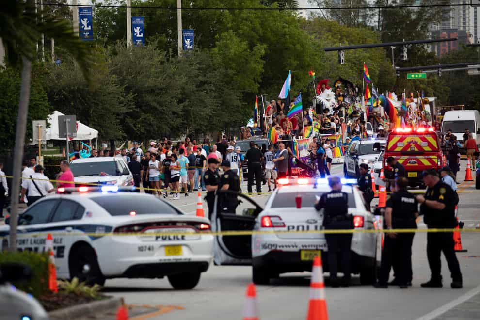 Police and firefighters respond after a truck drove into a crowd of people injuring them during The Stonewall Pride Parade and Street Festival in Wilton Manors