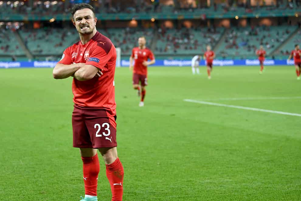 Xherdan Shaqiri celebrates scoring his side’s third goal against Turkey in Baku