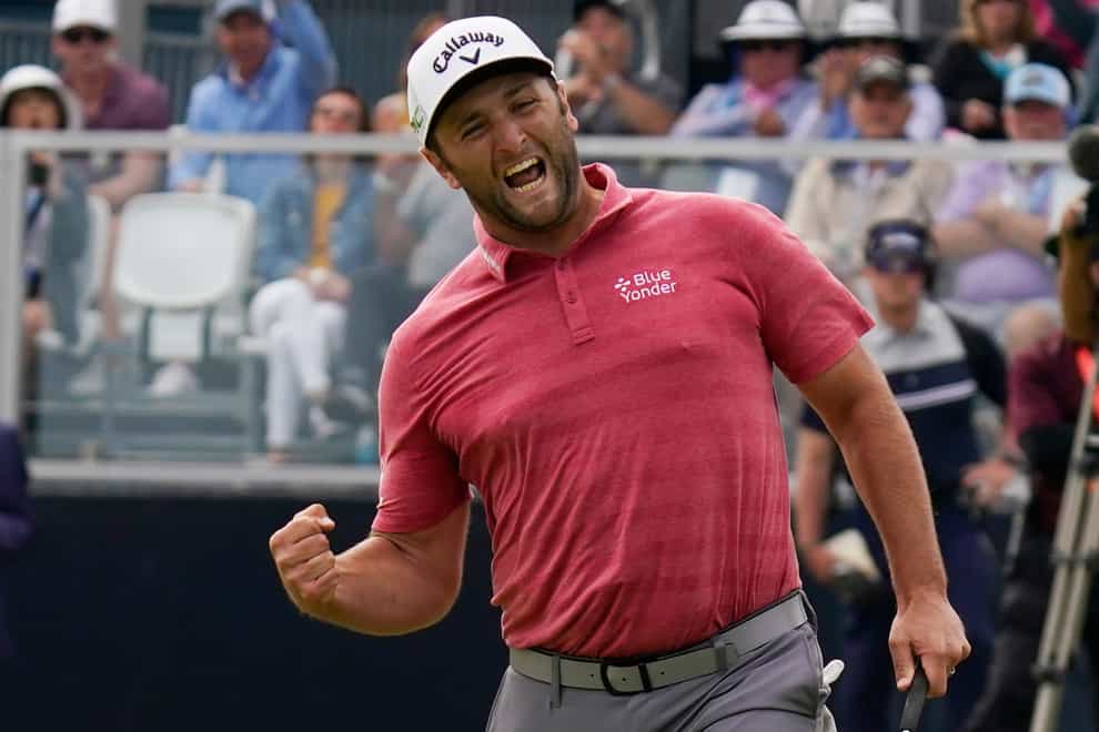 Jon Rahm reacts to making his birdie putt on the 18th green in the final round of the US Open