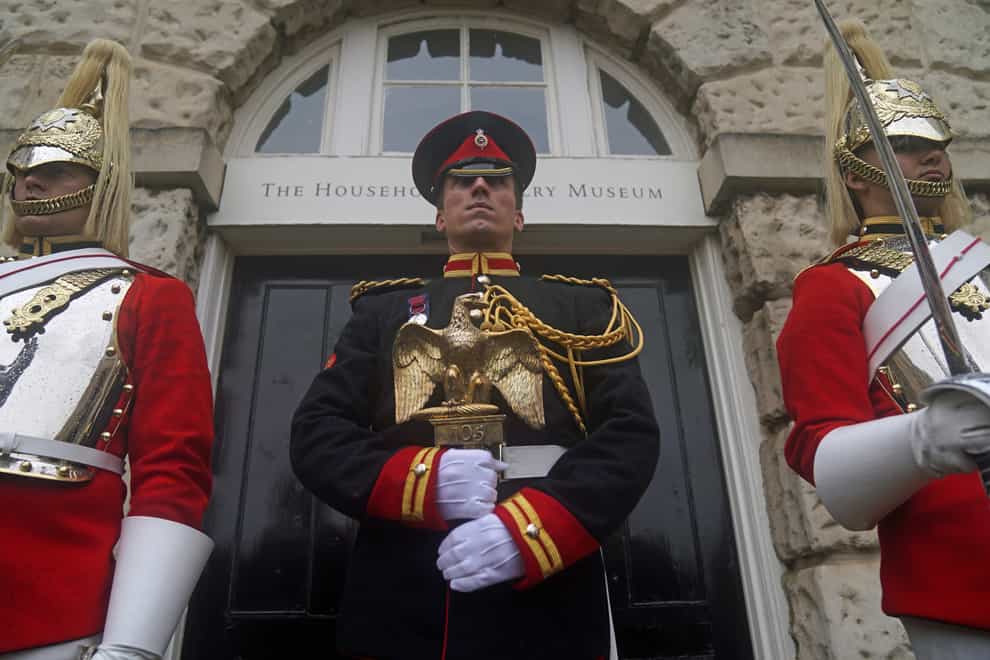 A Lance Corporal of Horse holds the Waterloo Eagle outside the Household Cavalry Museum