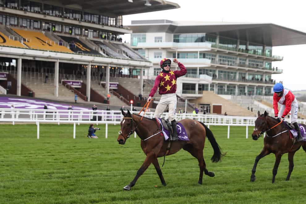 Jockey Jack Kennedy celebrates winning the WellChild Cheltenham Gold Cup Chase on Minella Indo ahead of A Plus Tard and Rachael Blackmore (right)