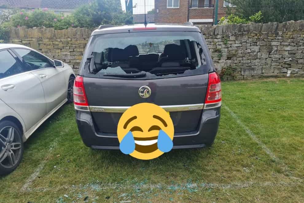 The car of an unlucky batsman, who hit a cricket ball through his own window