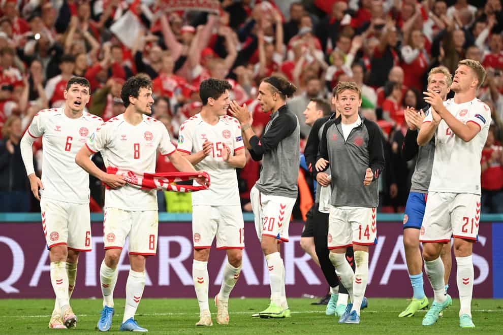 Denmark players celebrate after the 4-1 win over Russia. (Jonathan Nackstrand/AP).