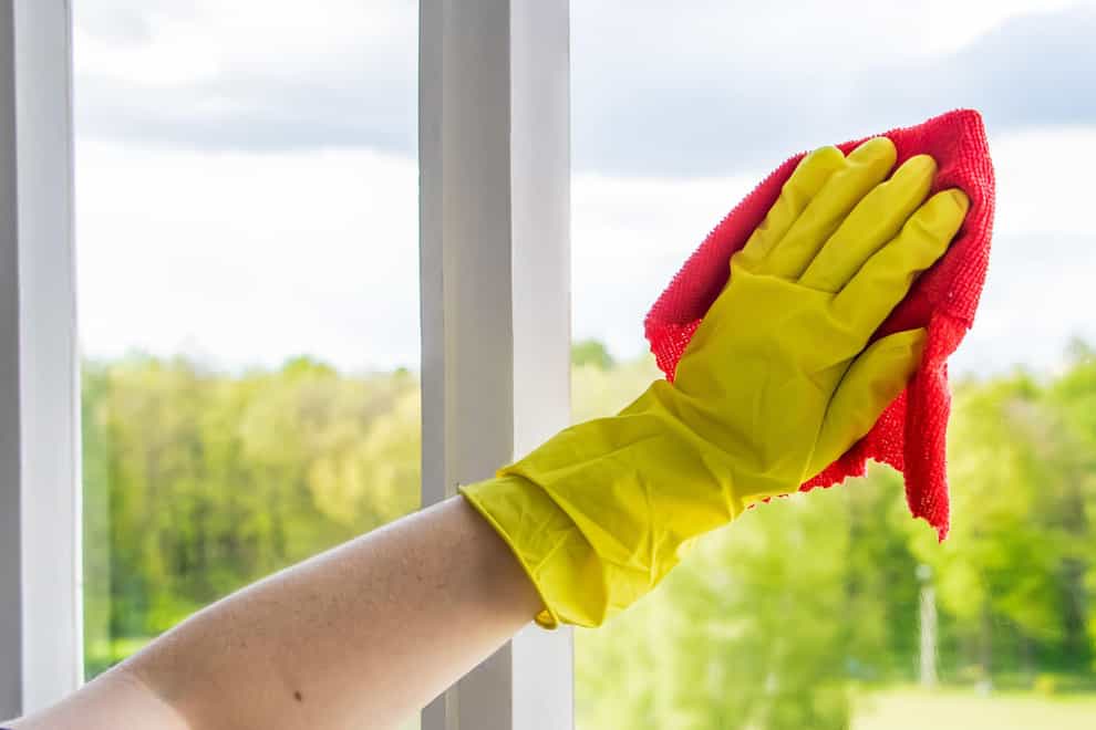 hand cleaning a window