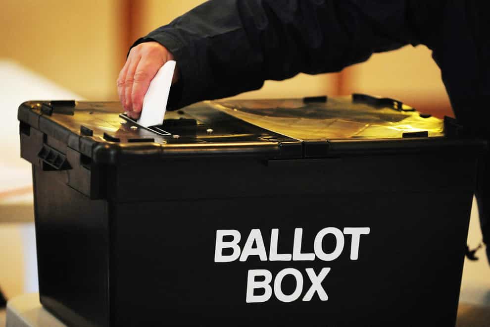 Man places vote in ballot box