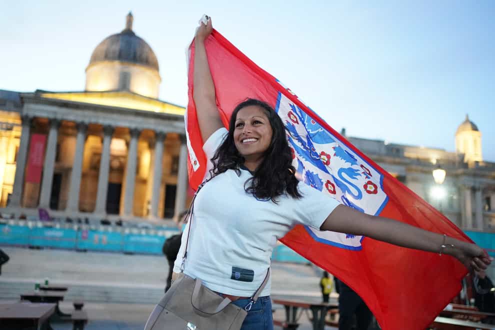An England fan reacts in the fan zone in Trafalgar Square, London