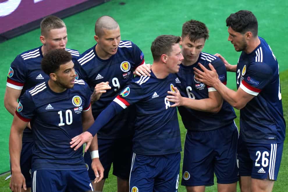 Callum McGregor, centre, celebrates his first Scotland goal