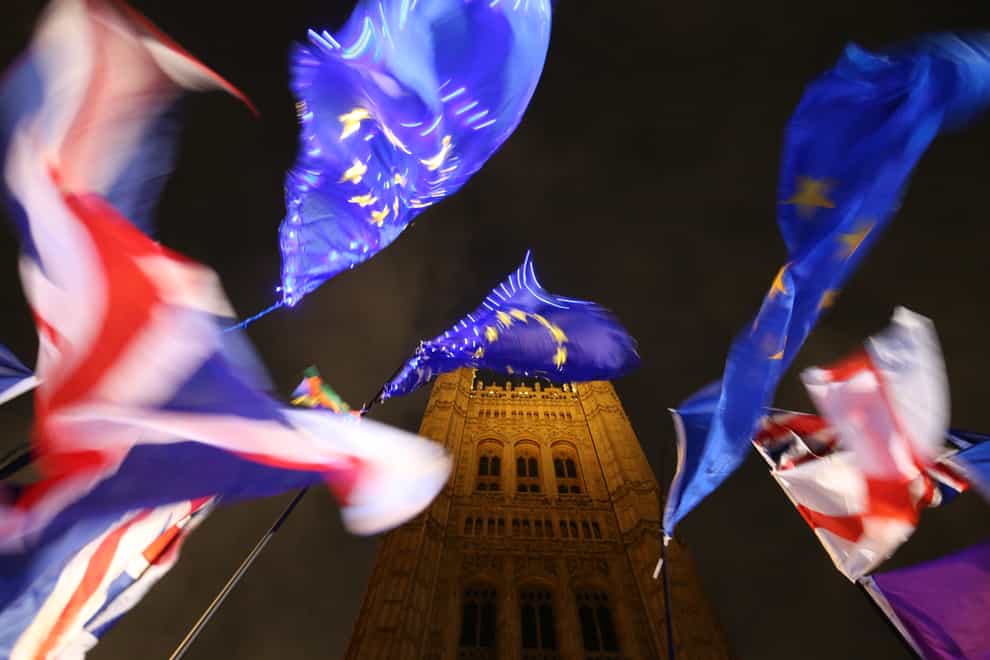 Union and EU flags outside the Houses of Parliament