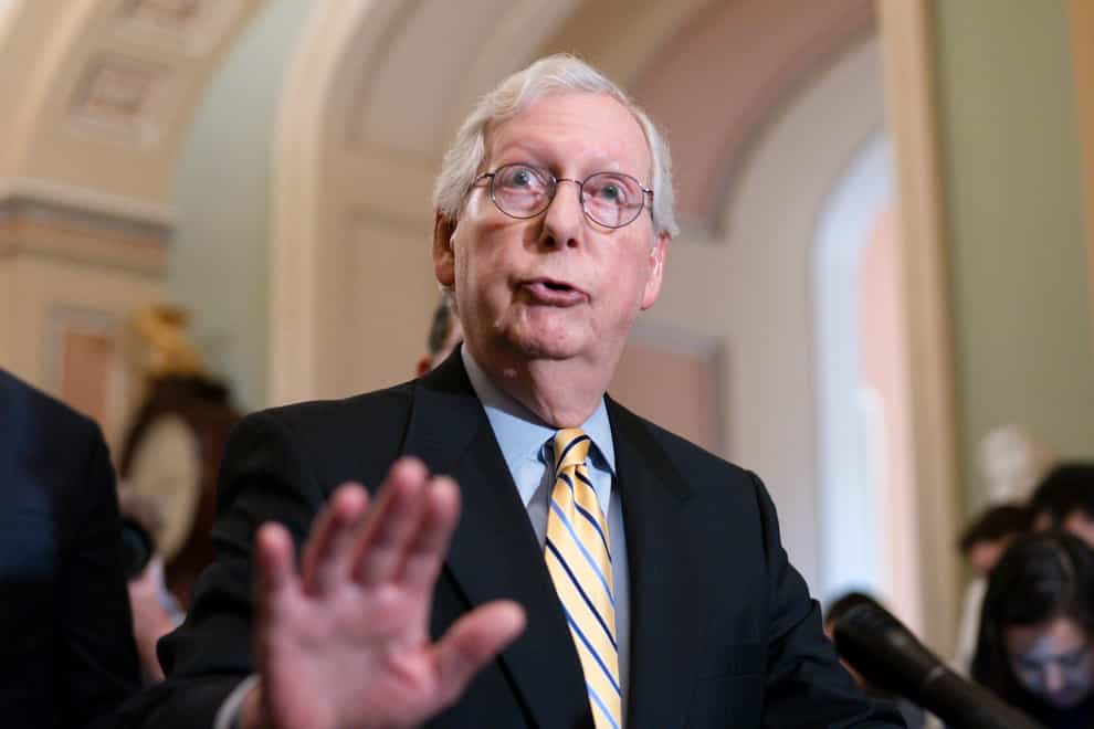 Senate Minority Leader Mitch McConnell talks with reporters at the Capitol