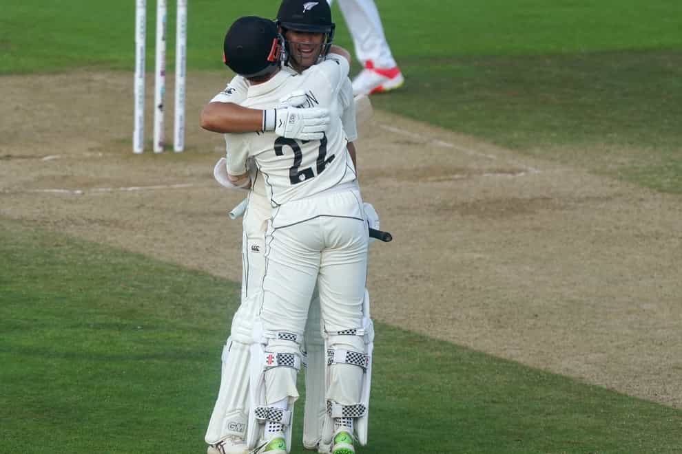 Kane Williamson (right) and Ross Taylor celebrate winning the match