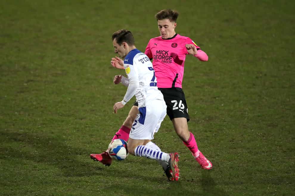 Peterborough midfielder Flynn Clarke (right) has joined Norwich for an undisclosed fee