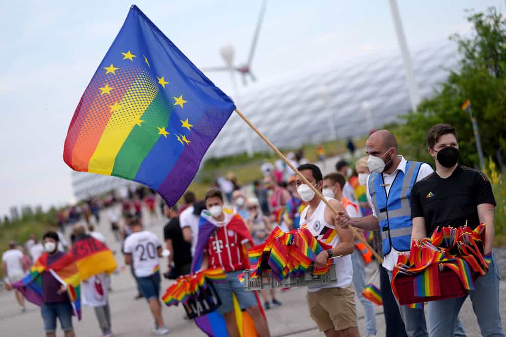 Football fans with LGBT flag