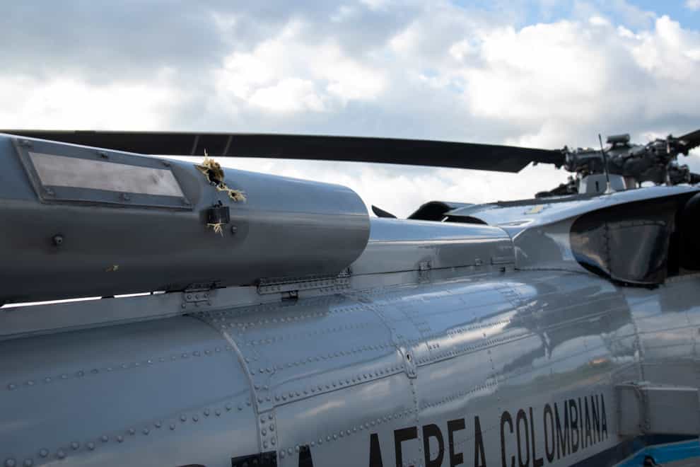 Bullet holes are seen on the fuselage of a Colombian Air Force helicopter that were fired while Colombia’s President Ivan Duque and members of his cabinet were traveling on the helicopter