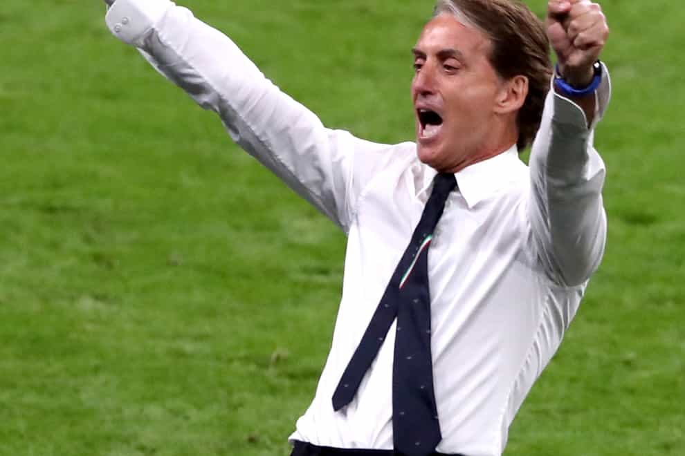 Italy manager Roberto Mancini celebrates reaching the quarter-finals of Euro 2020