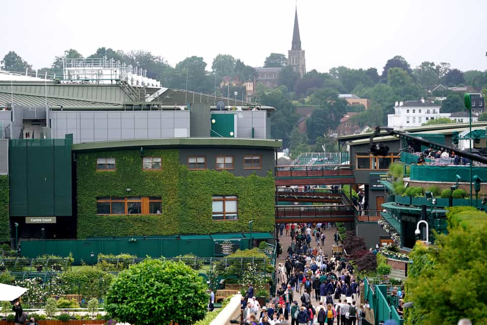 <p>People arrive in Wimbledon</p>
