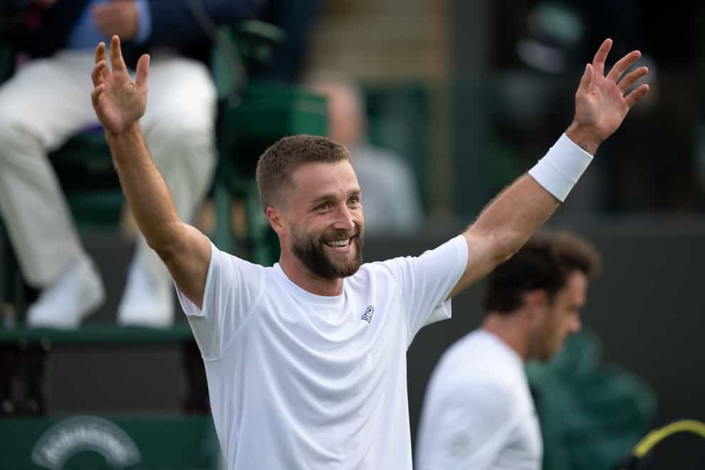Liam Broady celebrates after defeating Marco Cecchinato at Wimbledon