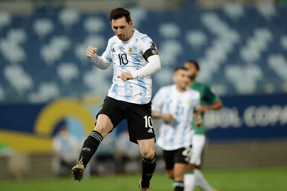 Lionel Messi celebrates after scoring against Bolivia