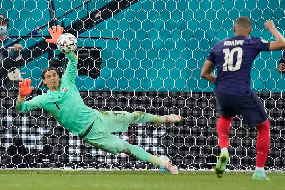 Switzerland’s goalkeeper Yann Sommer saves Kylian Mbappe's penalty