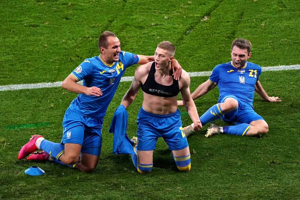 Artem Dovbyk, centre, scored a stoppage-time winner in extra-time to set up a quarter-final tie with England