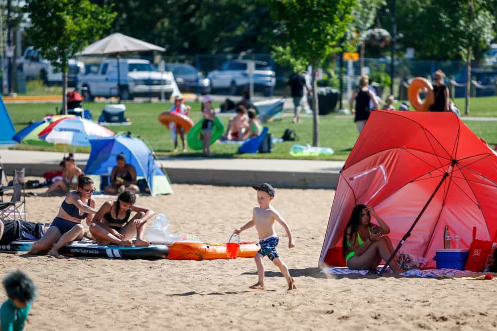 People try to beat the heat at a beach in Alberta