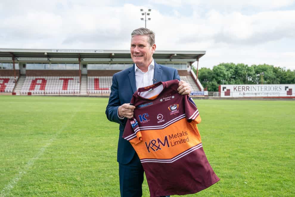 Labour Leader Sir Keir Starmer is given a rugby shirt during a visit to Batley Bulldogs rugby league ground (Danny Lawson/PA)