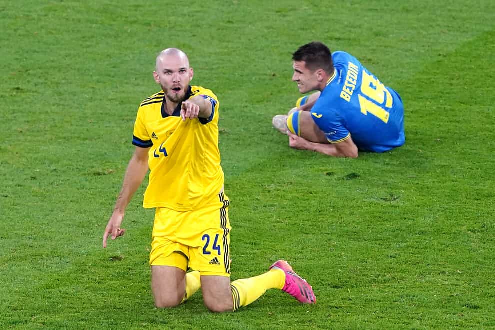 Ukraine's Artem Besedin (right) in the aftermath of Marcus Danielson's (left) red card challenge on him