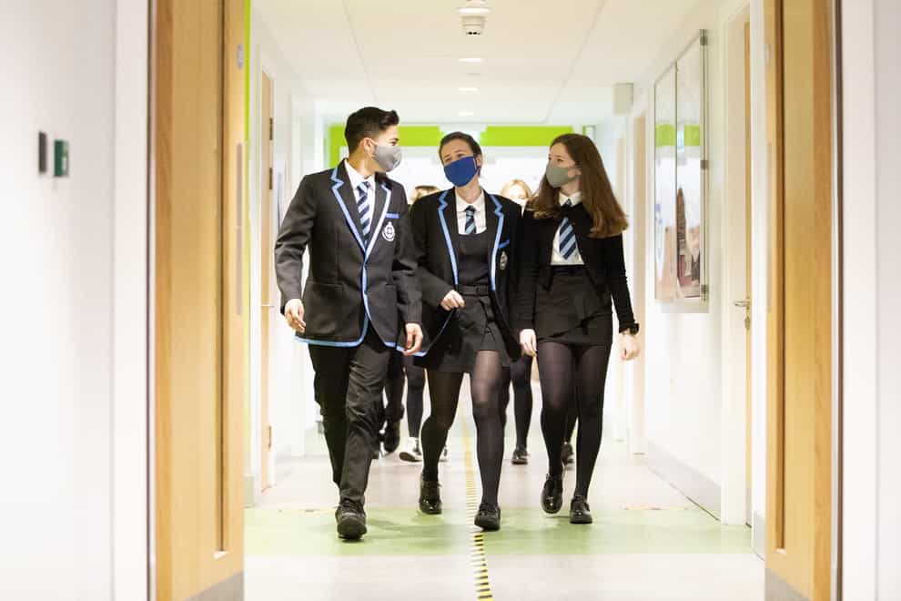 Students wear masks as they head to lessons