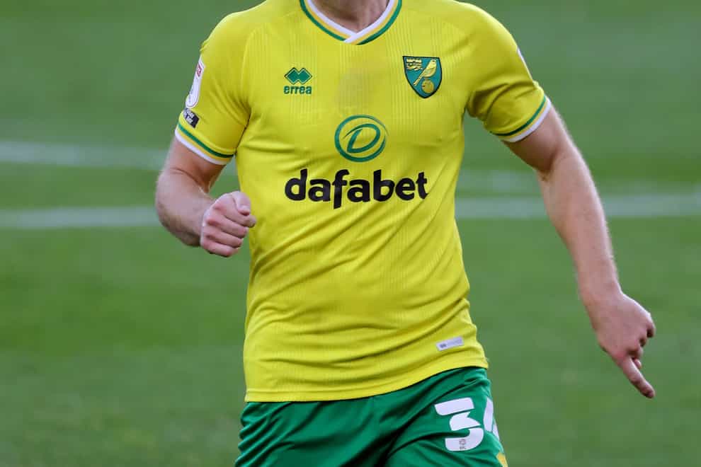 Norwich have signed Ben Gibson and Dimitris Giannoulis on permanent deals following successful loan spells