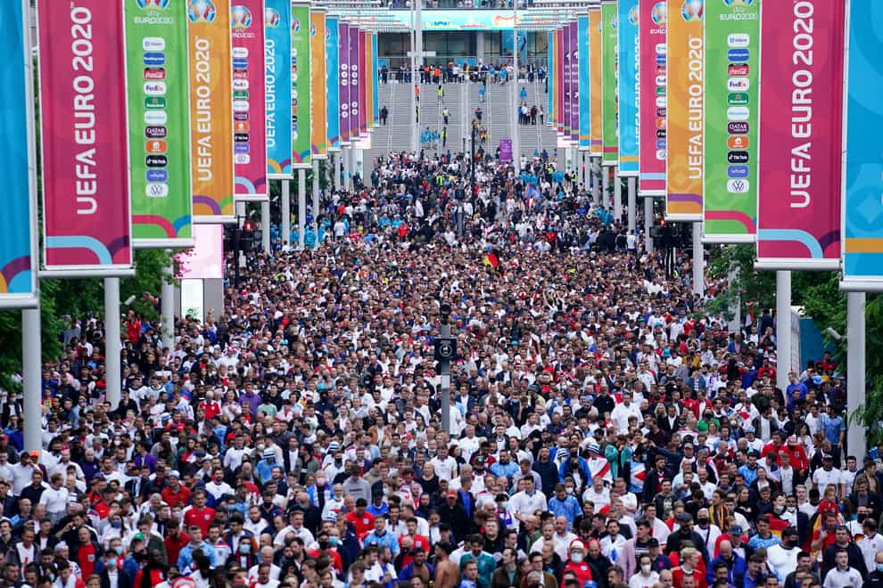 Fans leave Wembley stadium following the UEFA Euro 2020 round of 16 match between England and Germany at the 4TheFans fan zone outside Wembley Stadium (Zac Goodwin/PA)