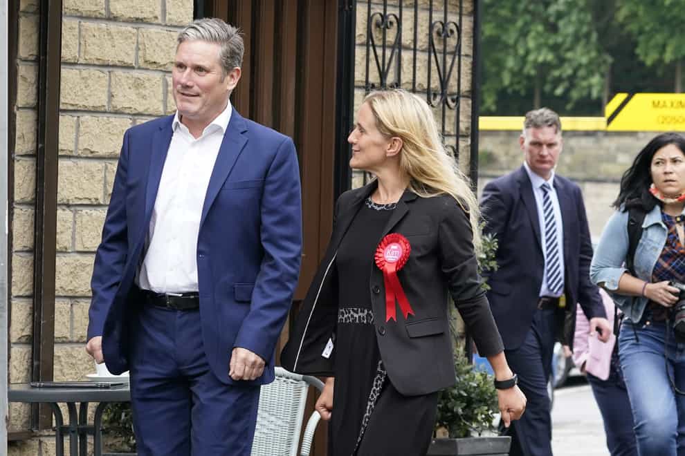 Labour party leader Keir Starmer walks with Kim Leadbeater in Clackheaton after she won the Batley and Spen by-election
