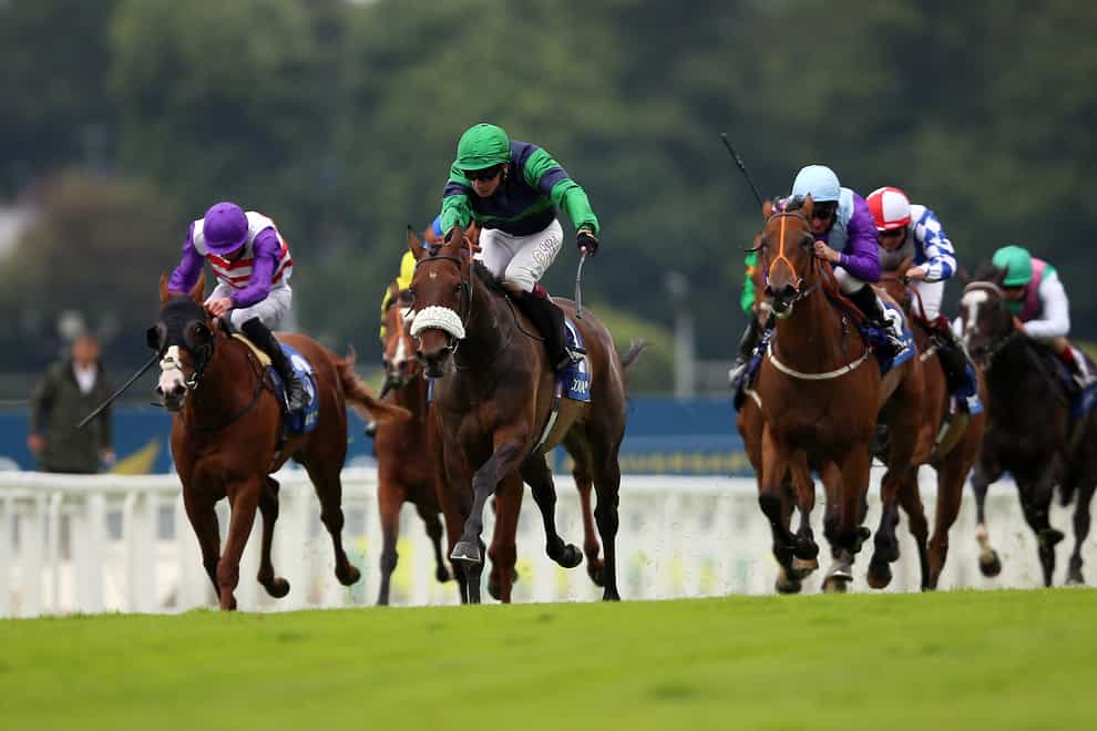 Auria (centre) on her way to winning the Coral Distaff at Sandown in the hands of Oisin Muphy
