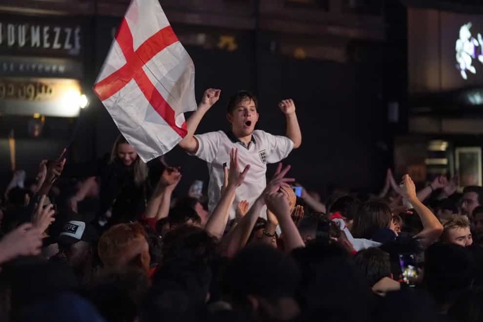 <p>Fans celebrate in Leicester Square, central London, after England beat Ukraine 4-0 in their Euro2020 quarter final match</p>