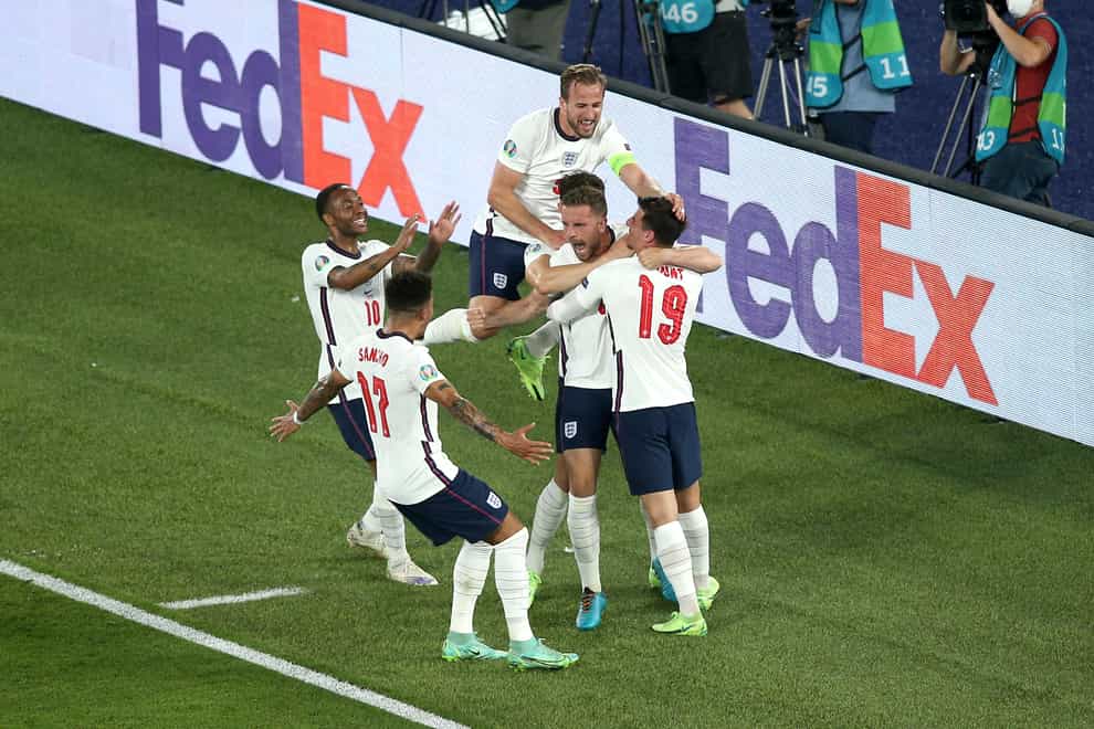 Jordan Henderson (centre) celebrates scoring England's fourth goal against Ukraine