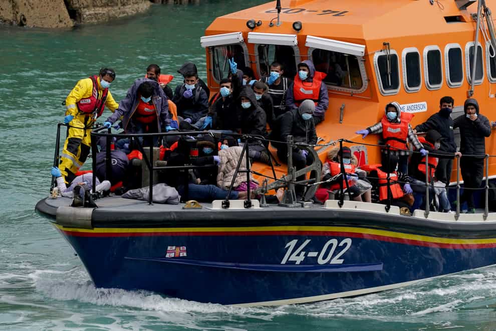 A group of people thought to be migrants are brought in to Dover, Kent, onboard a lifeboat following a small boat incident in the Channel on Sunday, July 4