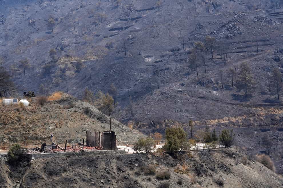 A burned house is seen on Troodos mountain, in Ora village, southwestern Cyprus (Petros Karadjias/AP)