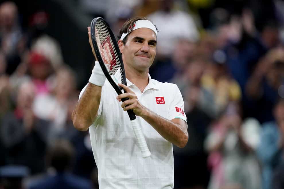 Roger Federer celebrates his win against Lorenzo Sonego