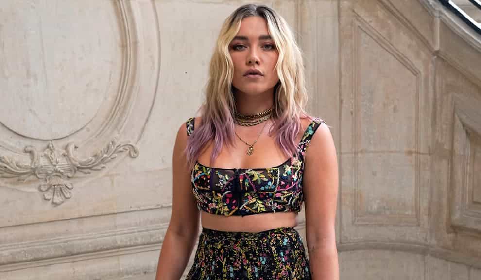 <p>British actress Florence Pugh chose an embellished crop top and skirt for Dior, accessorising her outfit with chunky lace-up boots and a tiny blue handbag</p>