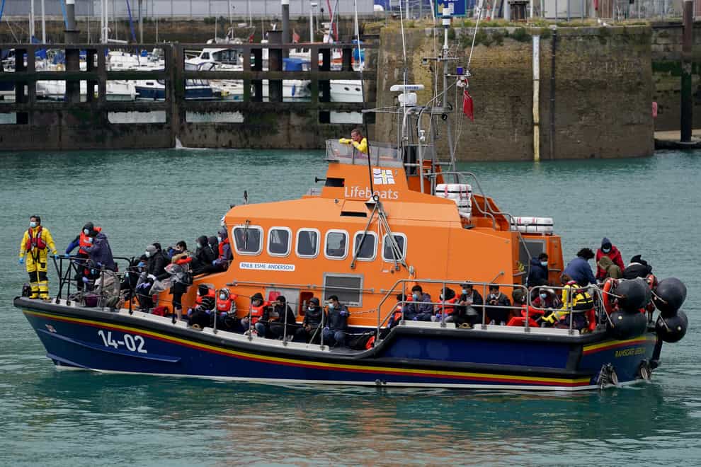 A group of people thought to be migrants are brought in to Dover on board a lifeboat