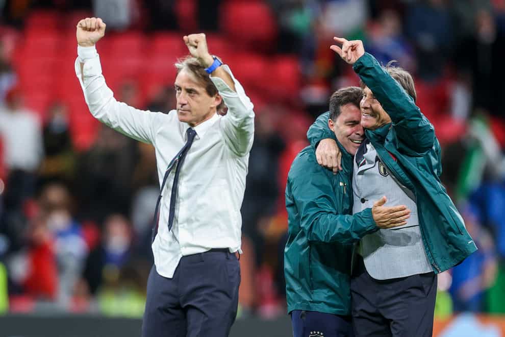 Roberto Mancini, left, celebrates Italy's win