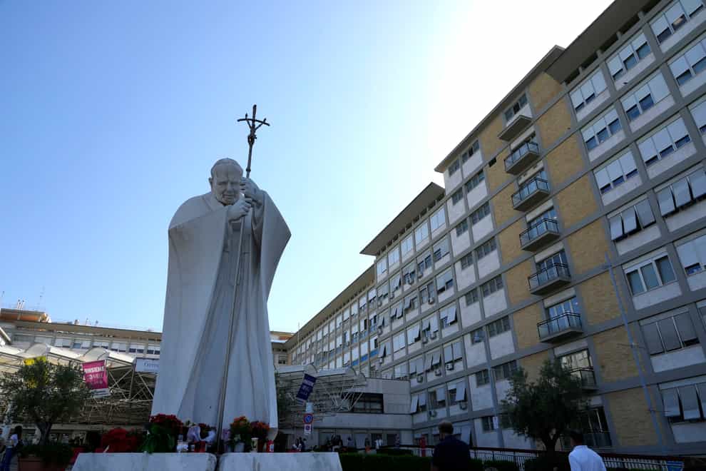 The statue of Pope John Paul II is seen at the entrance of the Agostino Gemelli Polyclinic in Rome, Wednesday, July 7, 2021, where Pope Francis is being treated (Alessandra Tarantino/AP)