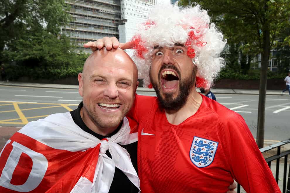 <p>England fans pose ahead of Wednesday's game against Denmark (Nick Potts/PA)</p>