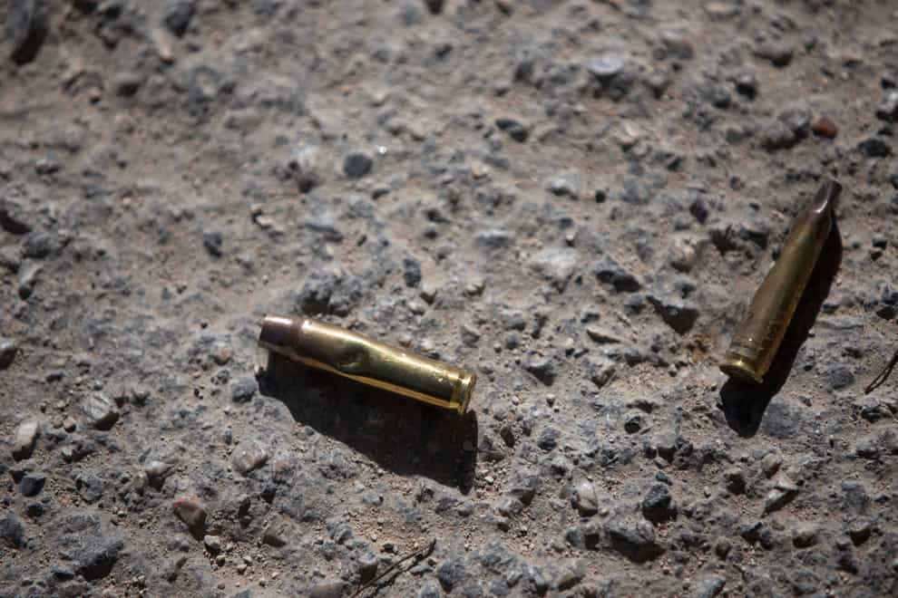 Ammunition casings lay on the ground near the entrance to the house of late Haitian President Jovenel Moise (Joseph Odelyn/AP)