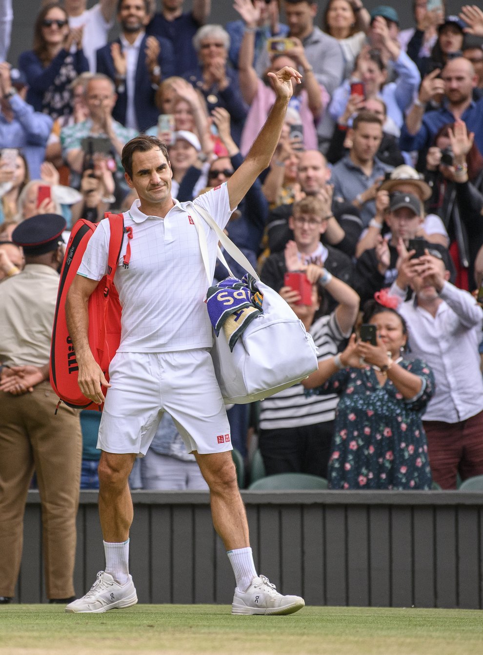 <p>Roger Federer waves an emotional goodbye to Centre Court</p>
