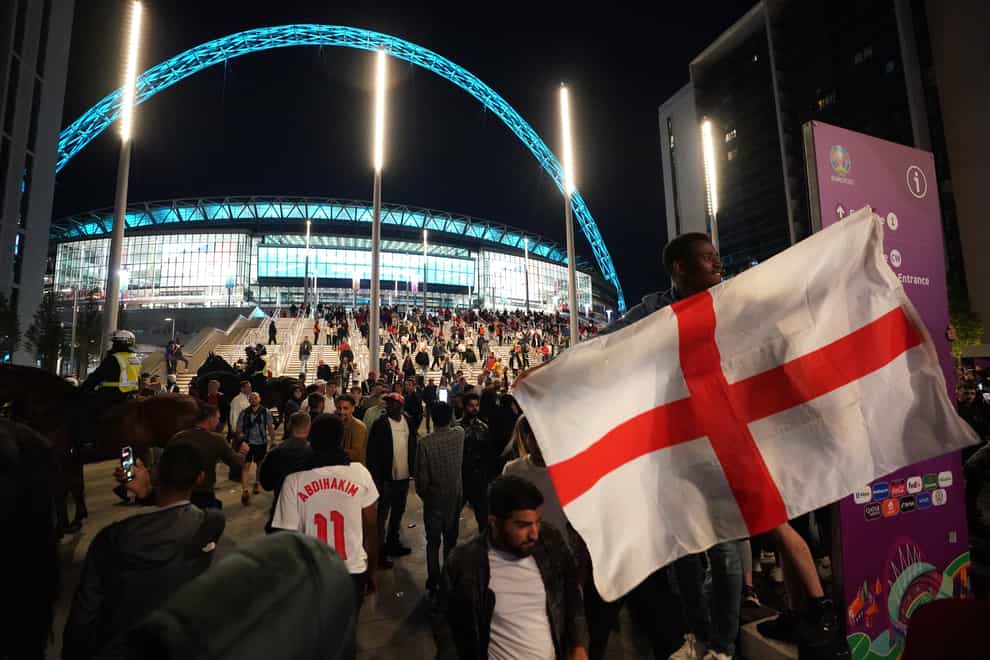 <p>England fans celebrate outside Wembley Stadium</p>