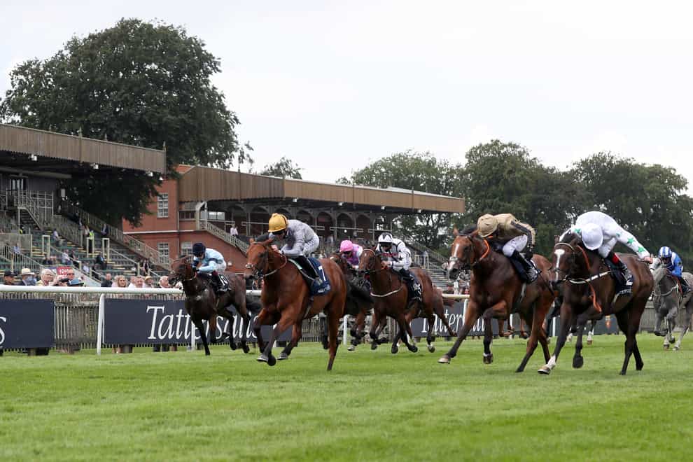 Lusail and Pat Dobbs (second left) won the Tattersalls July Stakes at Newmarket