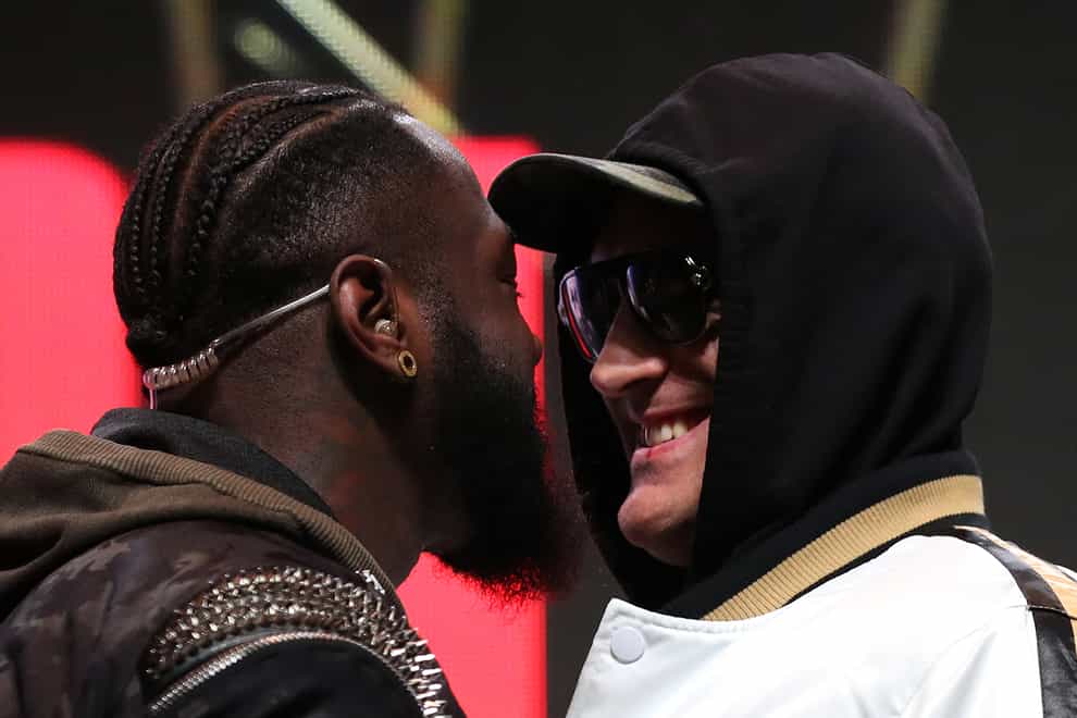 Deontay Wilder (left) and Tyson Fury eyeball each other at a weigh-in