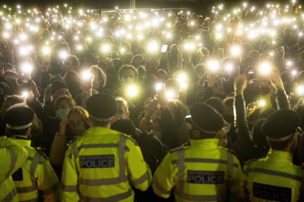 Members of the public light up their phones at a vigil for Sarah Everard on Clapham Common in March