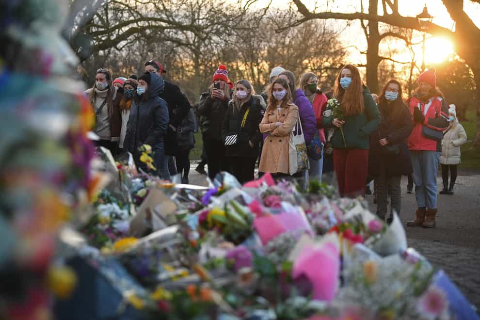 People gather at the bandstand on Clapham Common after the vigil for Sarah Everard was cancelled